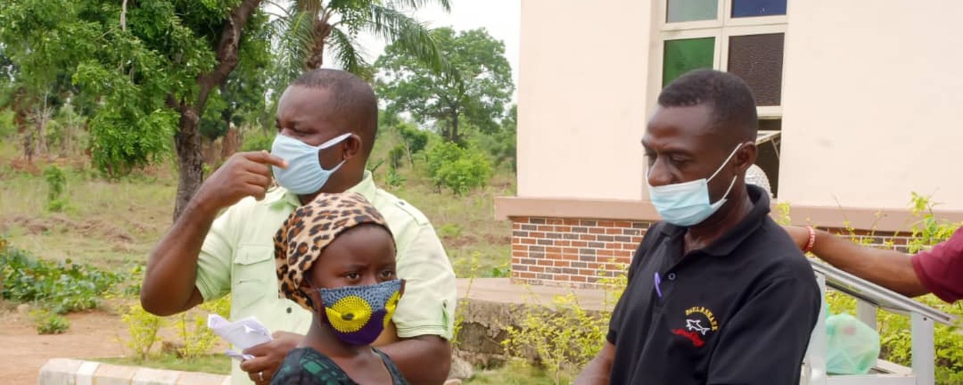 A child being attended to at a CORAfrica health outreach