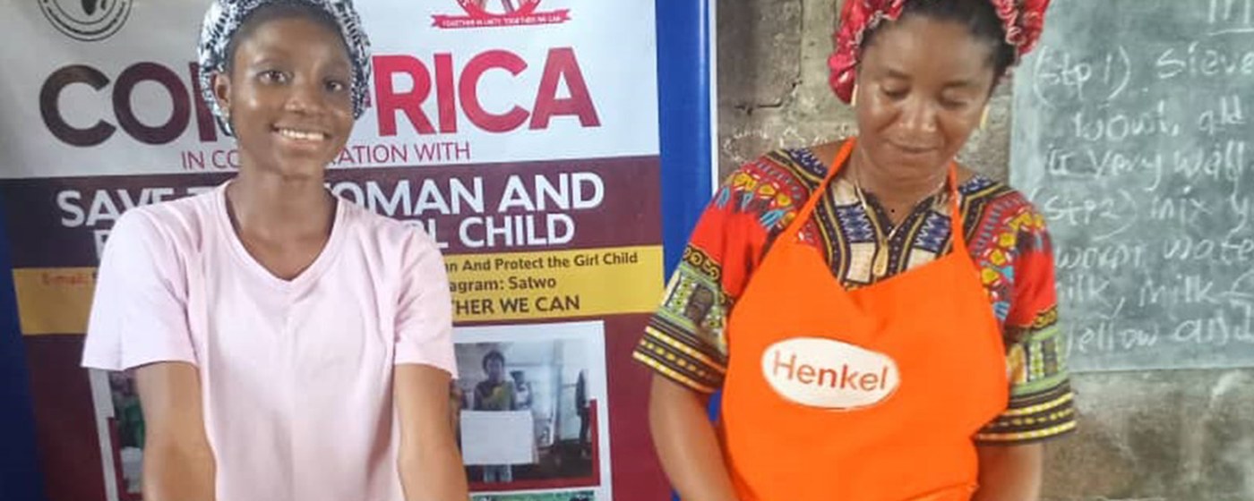 Women running a small food business supported by CORAfrica
