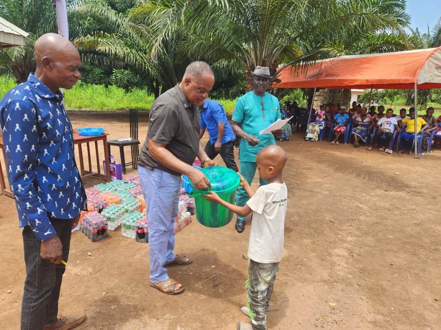 A child receives supplies at a CORAfrica distribution
