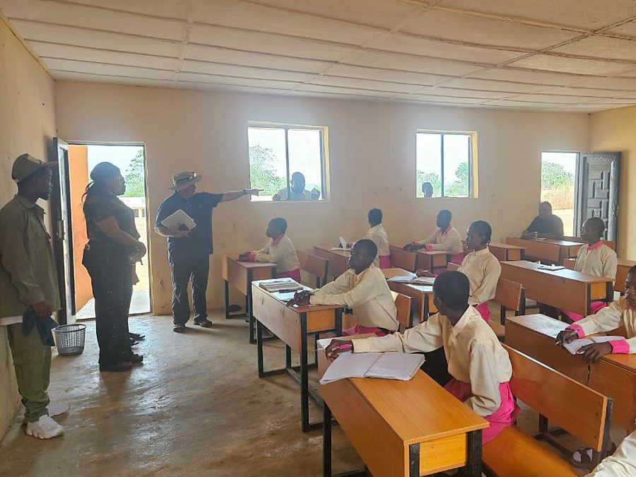 Pupils at their desks at John Bosco Academy, Adagom, with CORAfrica staff at the front