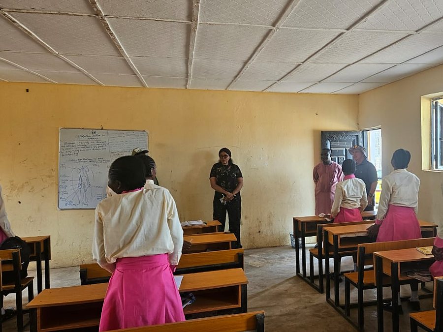 Pupils standing at their desks as a lesson begins