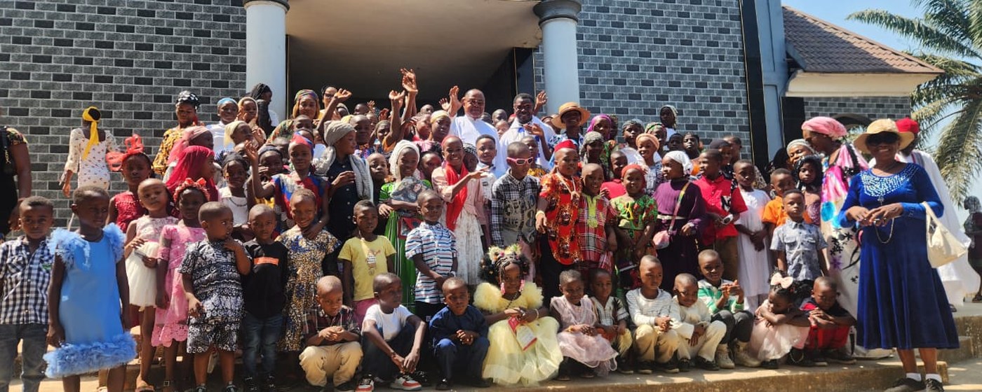 A community gathered with CORAfrica for a distribution